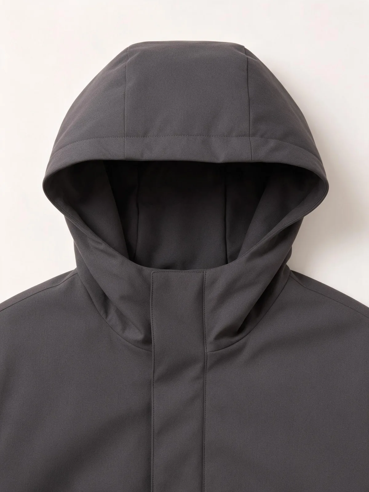Front view of a charcoal jacket hood opening and upper neckline.