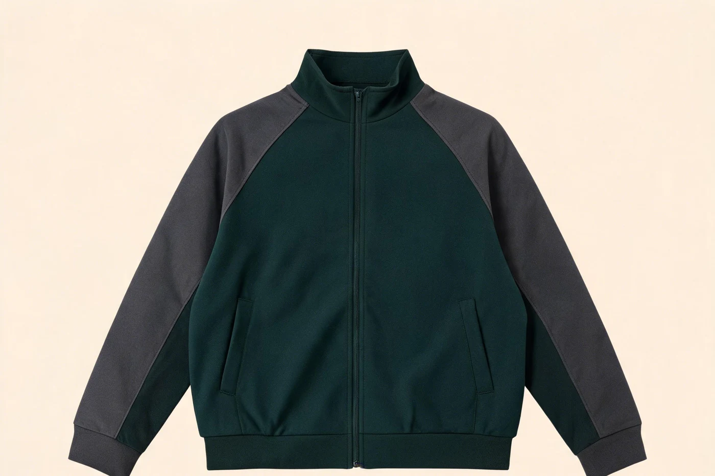 Dark green zip jacket with charcoal raglan sleeves and ribbed cuffs and hem.