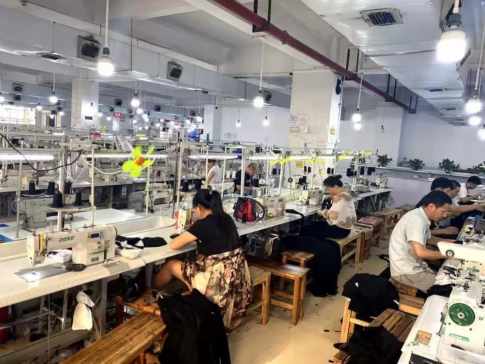 Workers at rows of sewing workstations in our garment workshop