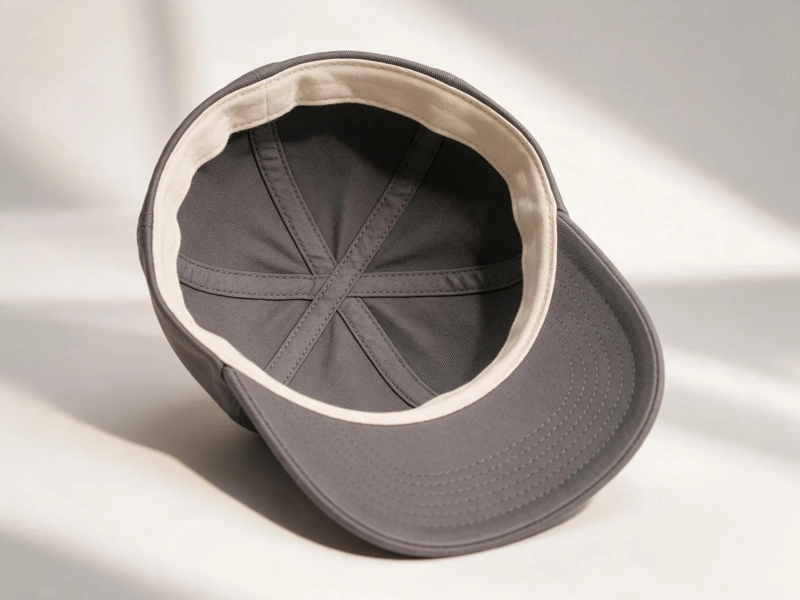 AI design concept showing the inside panels and sweatband of a charcoal cap