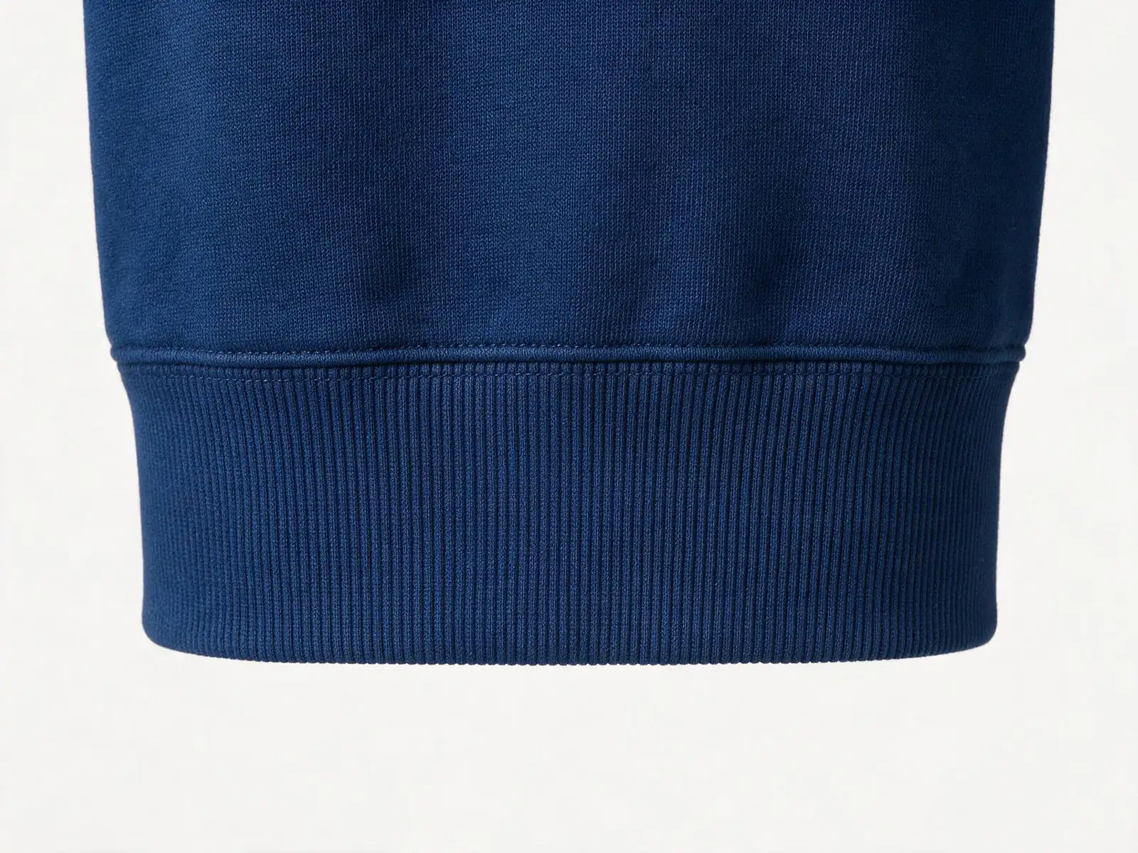 AI design concept showing a navy hoodie body joined to a ribbed hem.