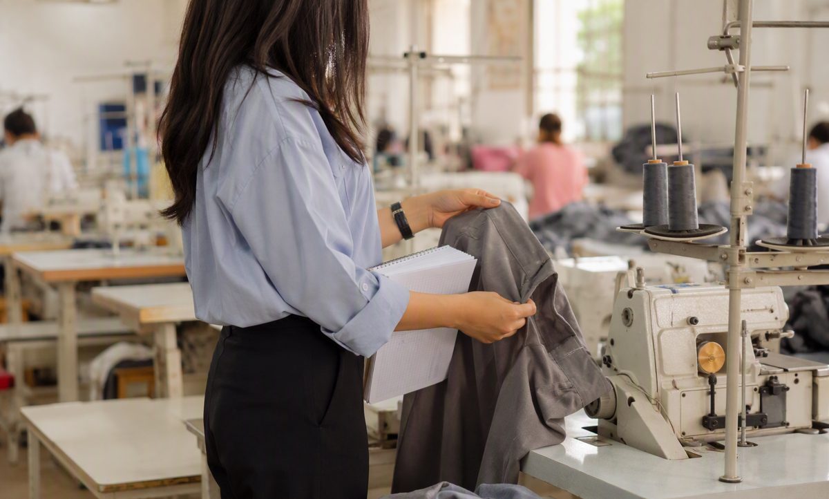 Inline QC: inspector checking seam quality at the sewing line