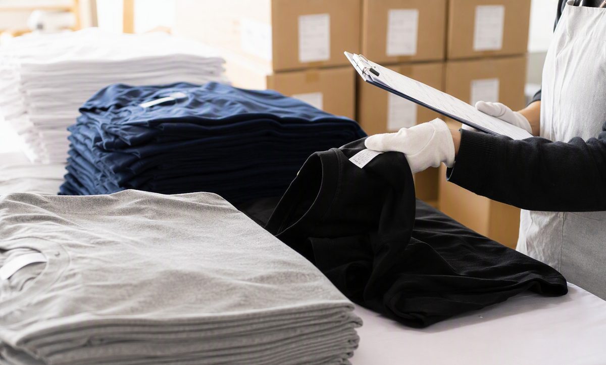 Final AQL inspection: checking finished garments and labels before packing