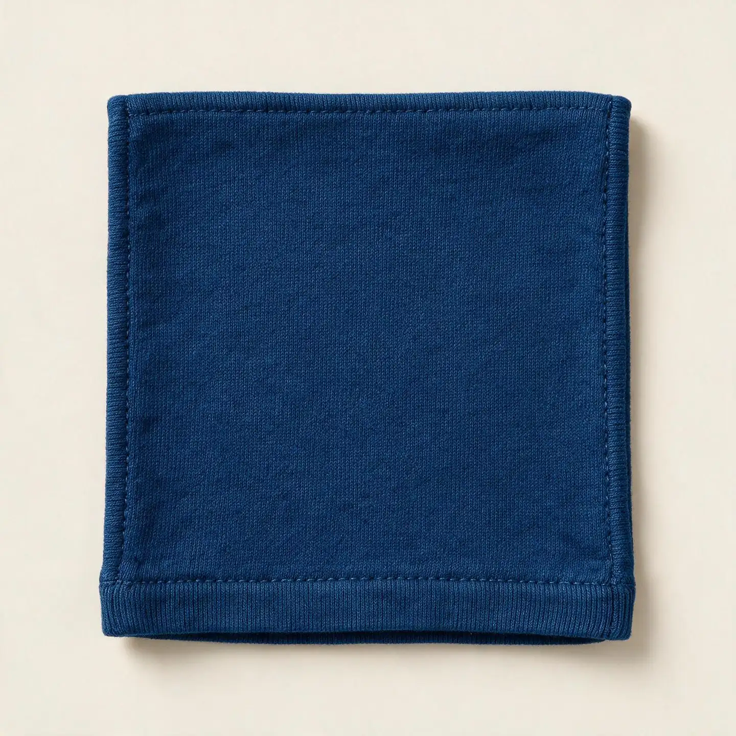 Close-up of reactive-dyed cotton fabric in an even saturated indigo shade