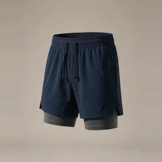 Navy drawstring shorts with a longer fitted inner layer.