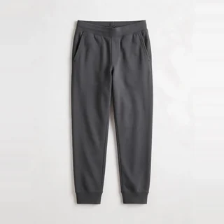 Charcoal sweatpants with side pockets and cuffed hems.